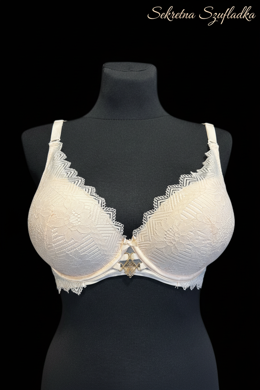 Cream lace bra front view on black background