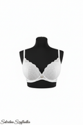 White lace bra front view on black torso